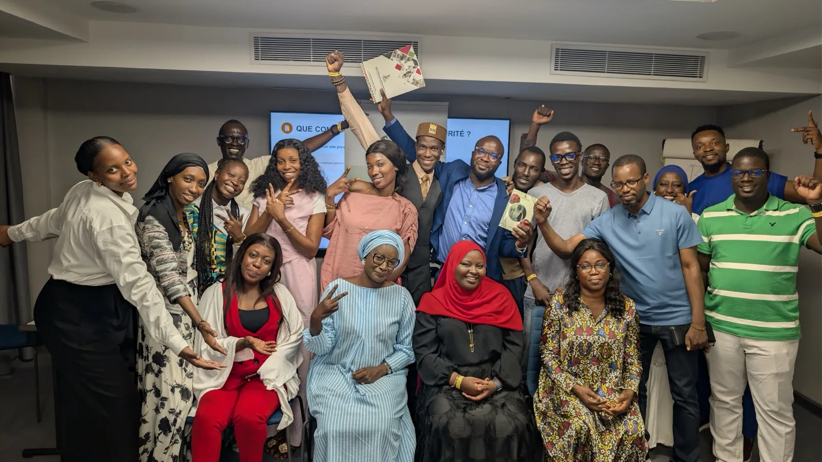 A cohort of Resilience Technologies training participants celebrating at the end of a session.